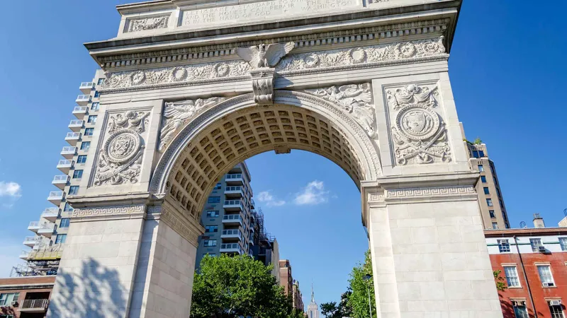 Washington Square Arch against a blue sky on a New York architecture tour of Greenwich Village