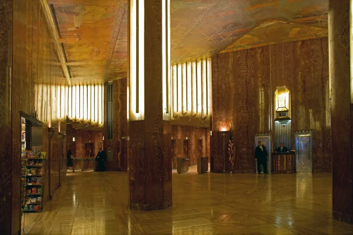 The Art Deco lobby of the Chrysler Building with its marble walls and elevator doors, a stop on a New York architecture tour