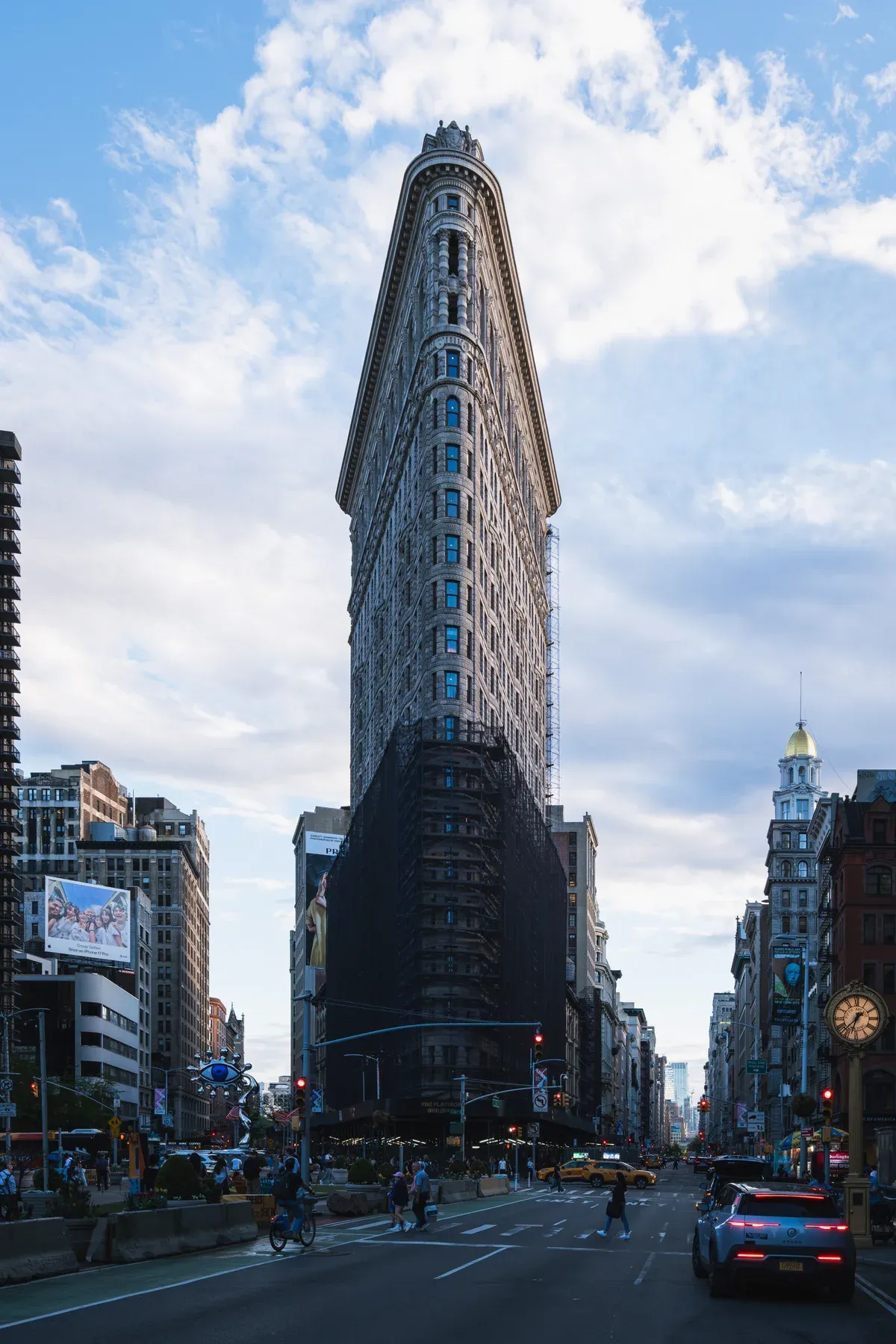 The narrow prow of the Flatiron Building at Fifth Avenue and Broadway in late-day light, on a New York architecture tour