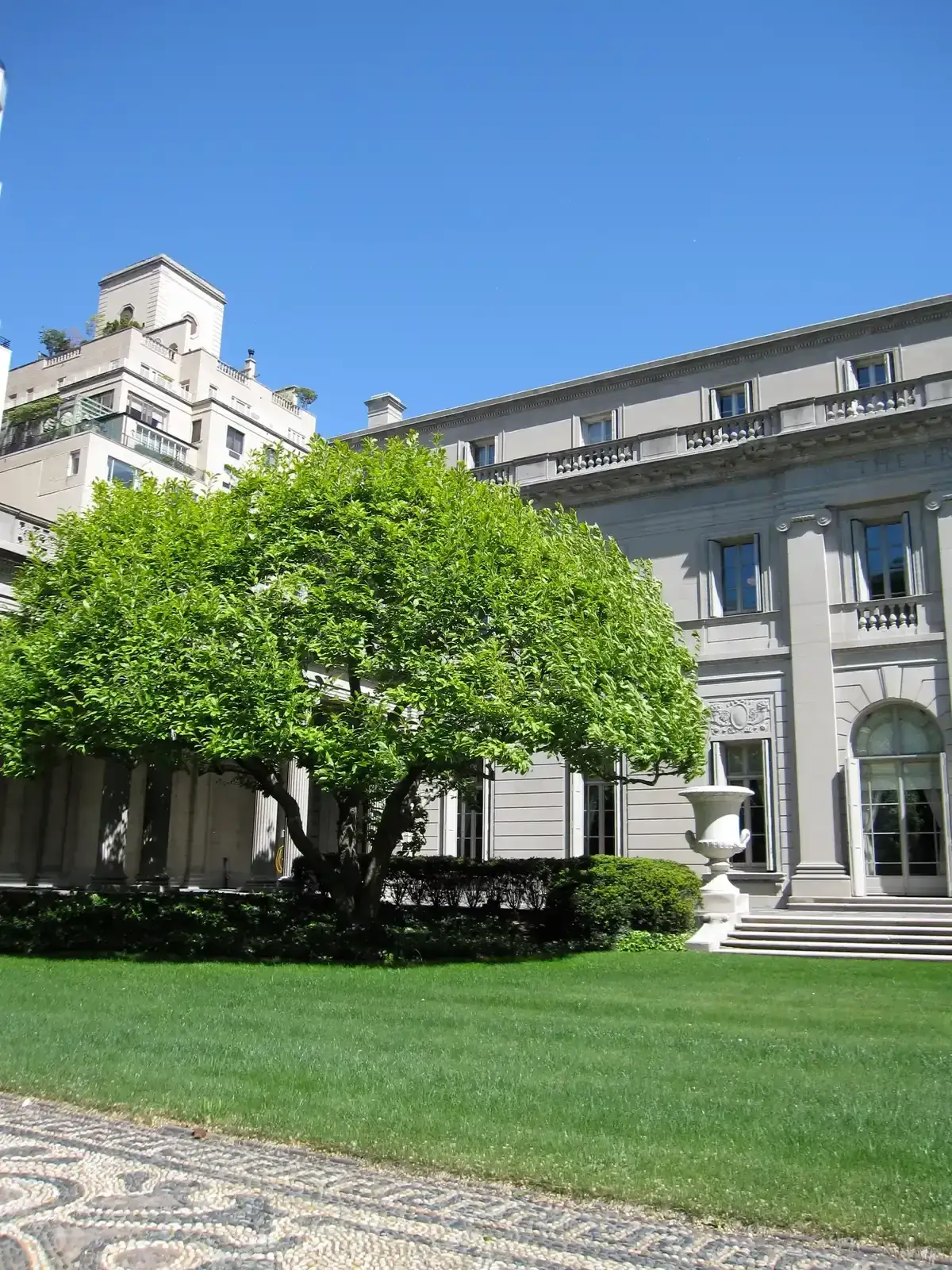The Henry C. Frick House on Fifth Avenue, home of the Frick Collection, seen across its garden, on a New York architecture tour