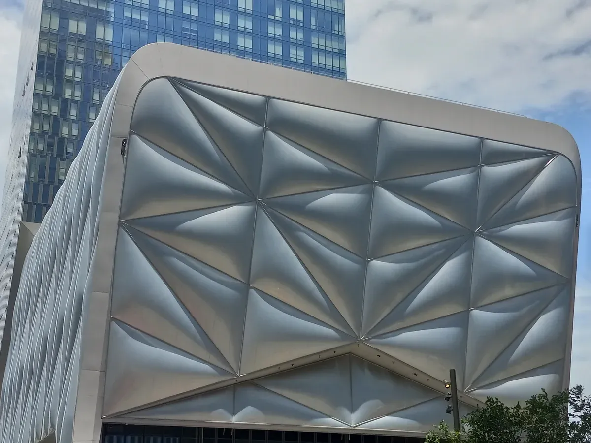 The faceted silver cladding of The Shed at Hudson Yards, on a New York architecture tour